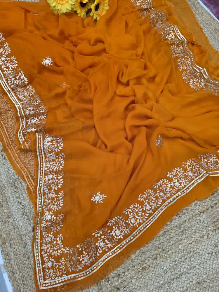 Rust orange pure chiffon pittan work saree