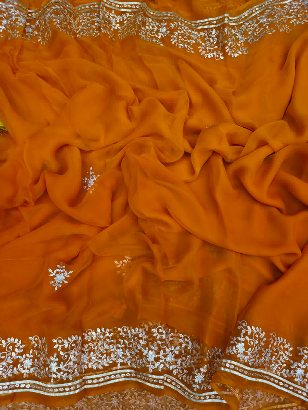 Rust orange pure chiffon pittan work saree